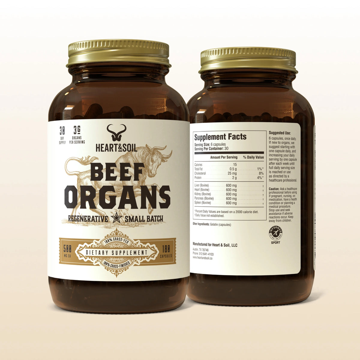 Two bottles of 'Heart & Soil Beef Organs' dietary supplement on a beige background