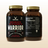 Two bottles of Georges St. Pierre's Warrior dietary supplement on a beige background